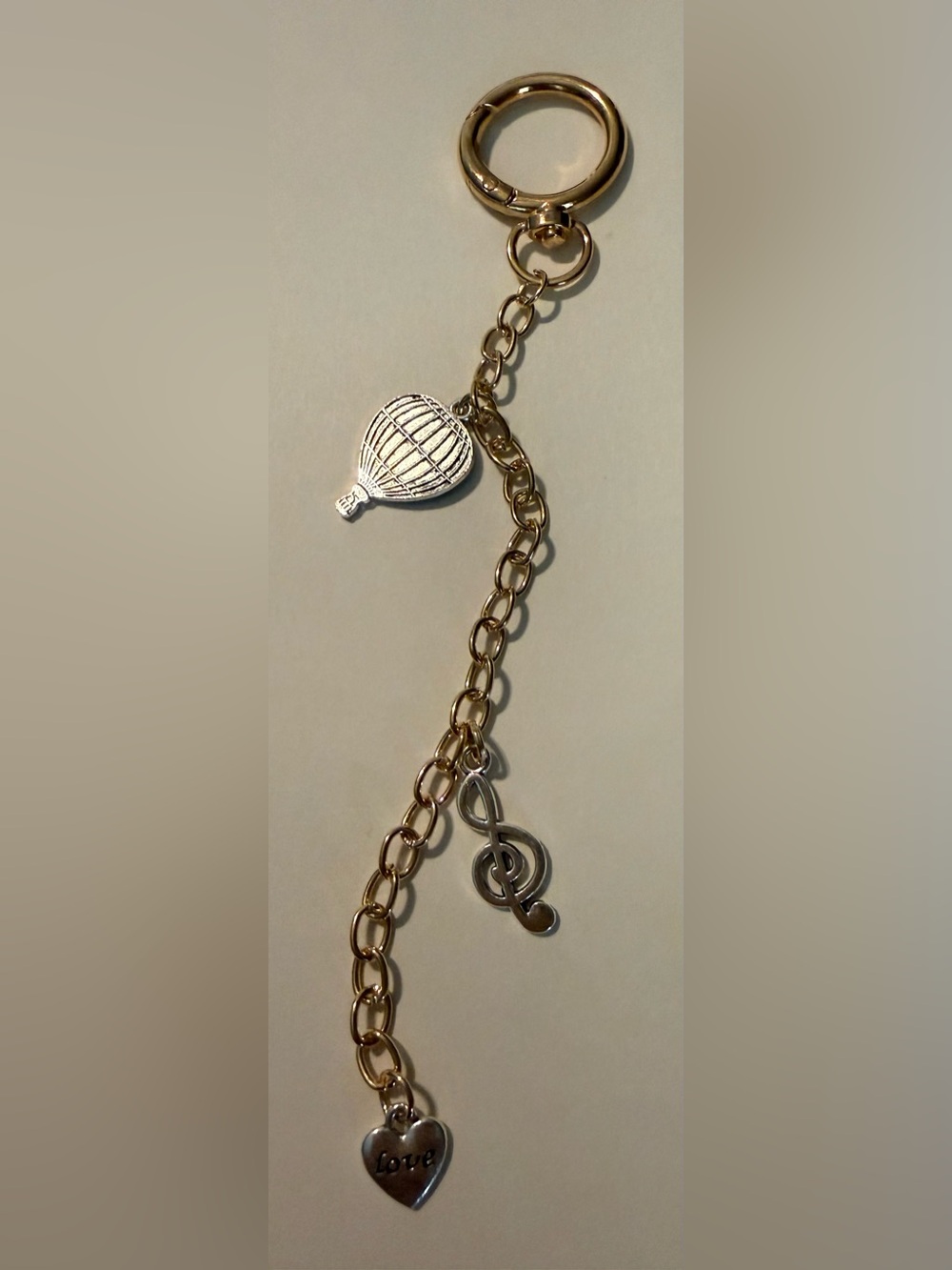 Gold-Tone Musical Charm with Hot Air Balloon Accent